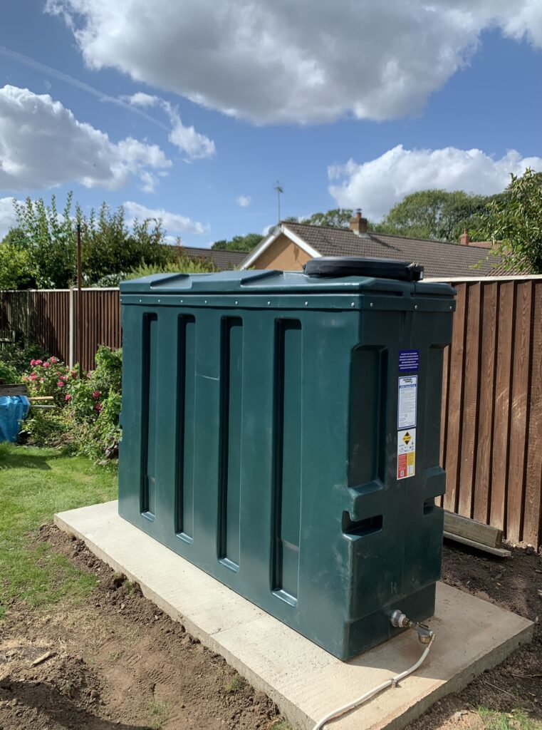 Slimline bunded oil tank installed in a garden