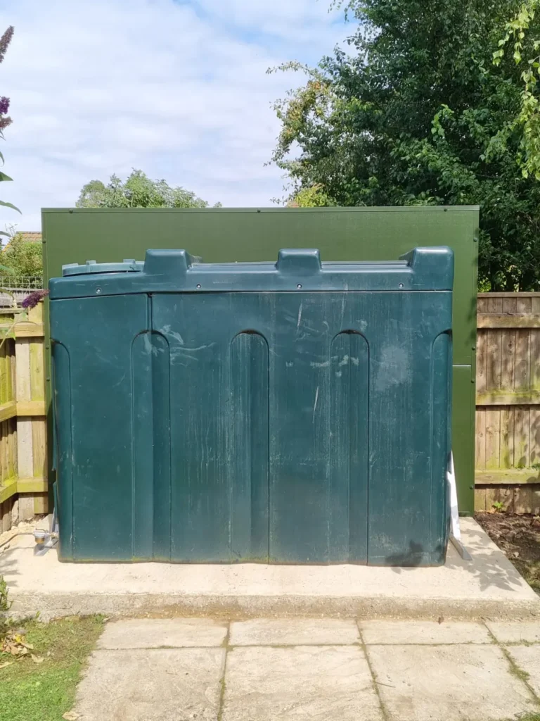 Fire wall installed behind an oil tank